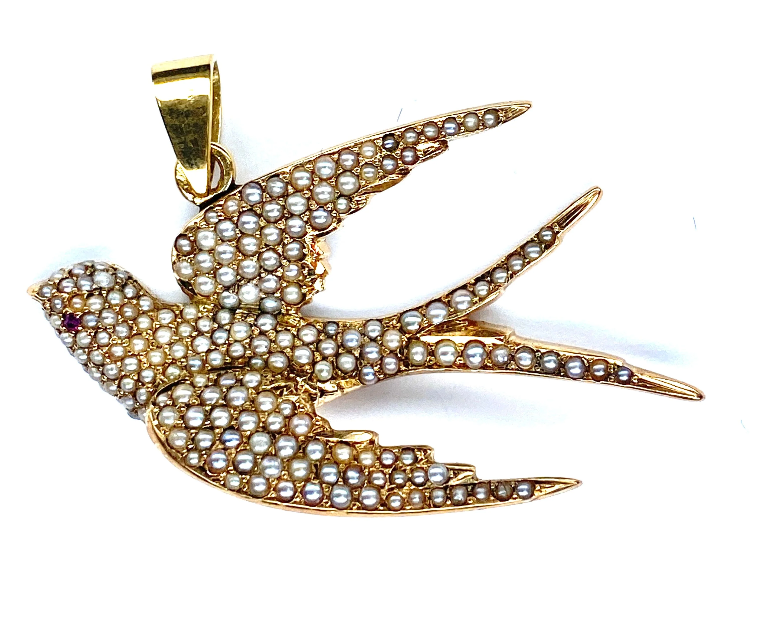 18-carat gold pendant: swallow made of fine pearls and rubies