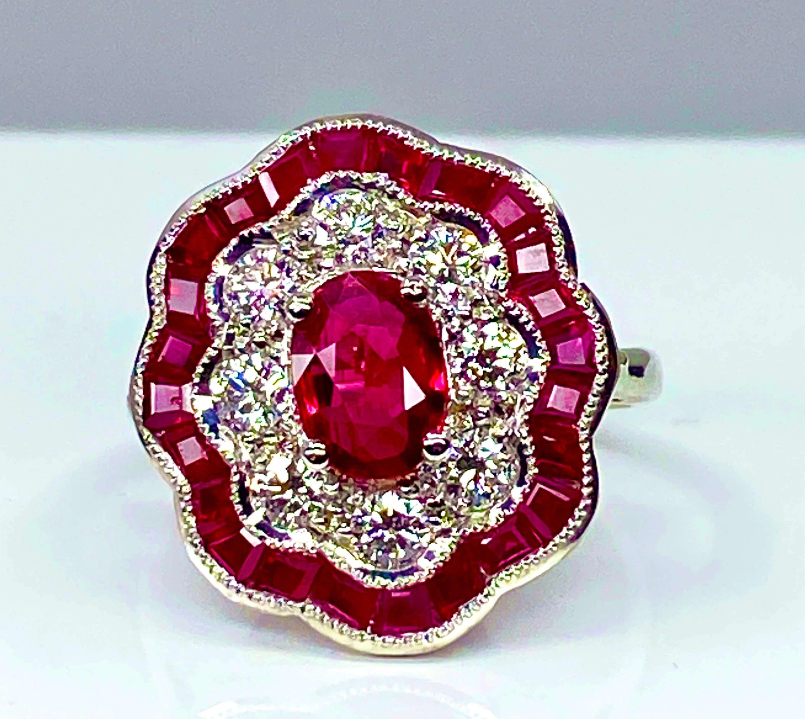 White gold ruby and diamond daisy ring