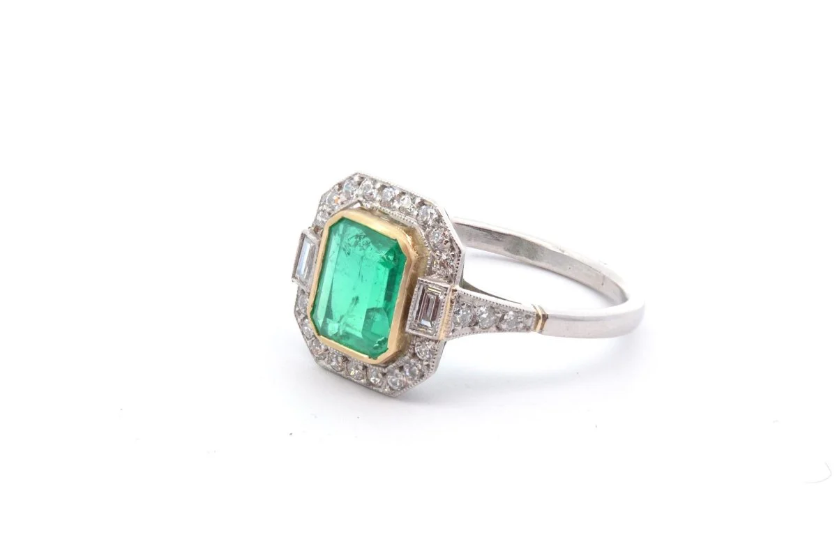 Emerald and diamond ring in gold and platinum