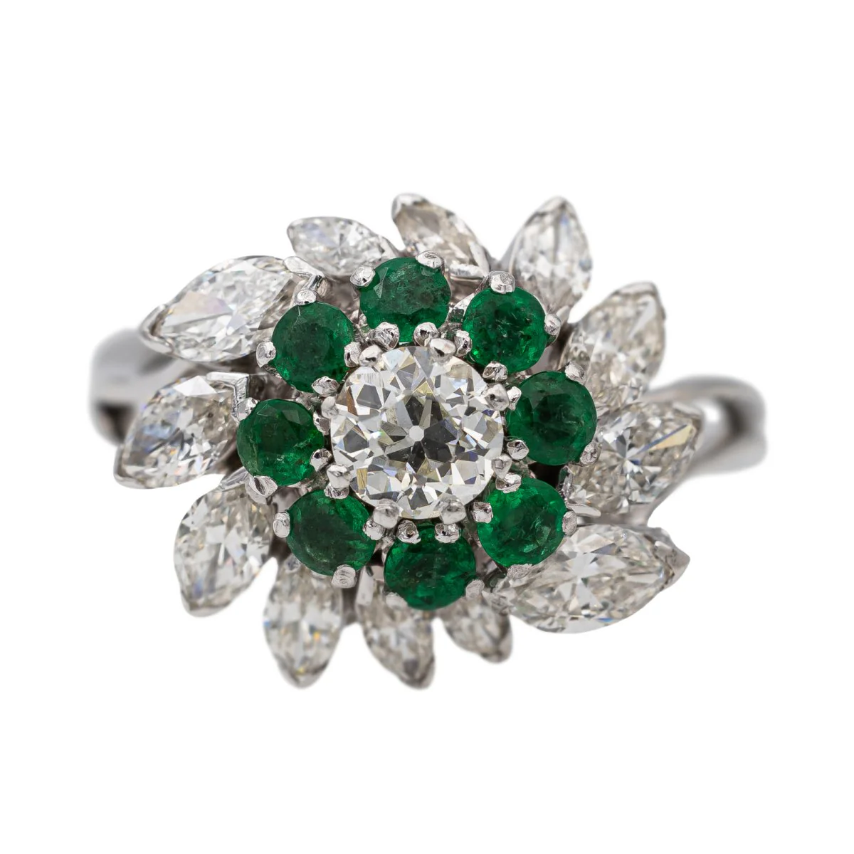 Marguerite ring in white gold, platinum, emeralds and diamonds