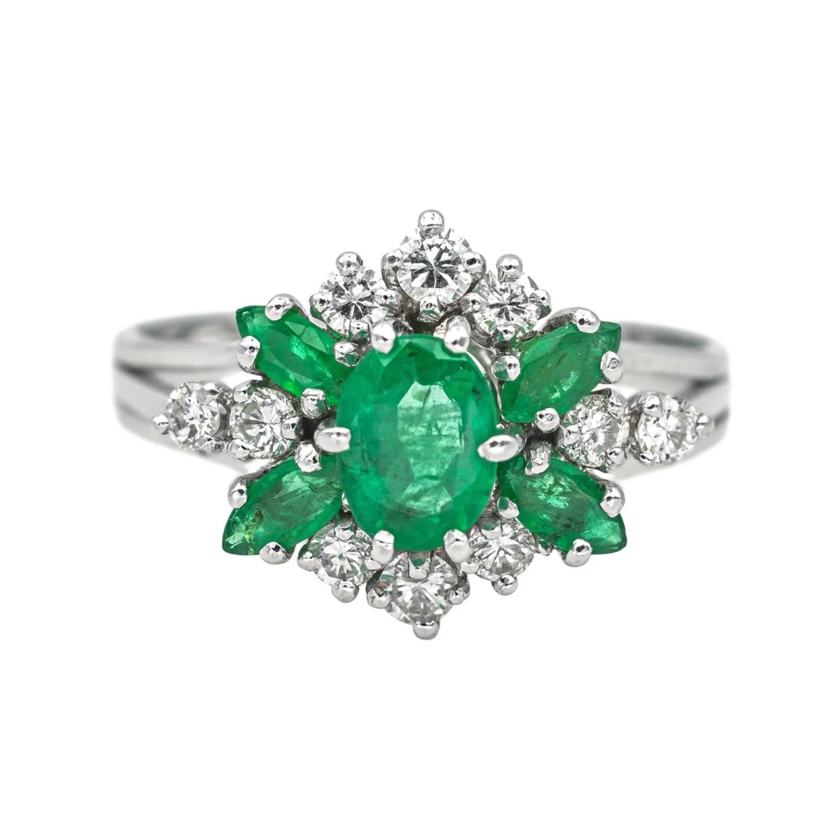 White gold ring with emeralds and diamonds