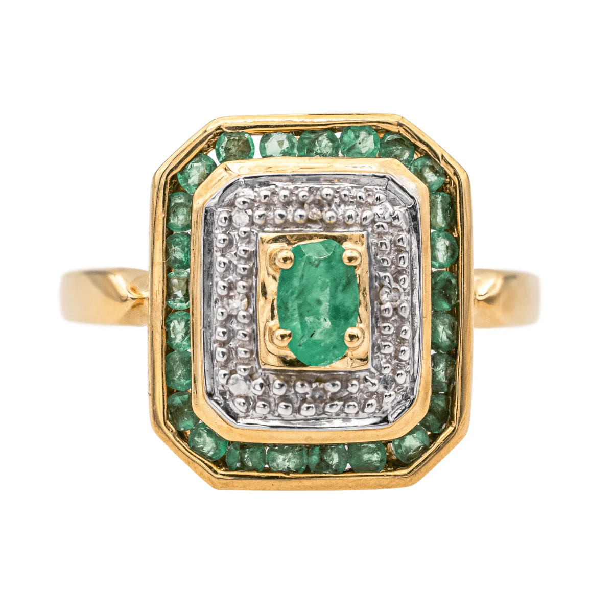 Ring at yellow gold, white gold, emeralds and diamonds