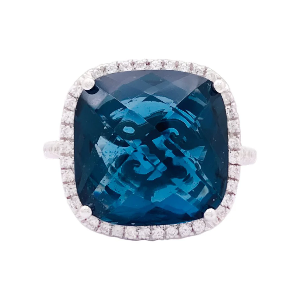 Ring at white gold, blue topaz and diamonds