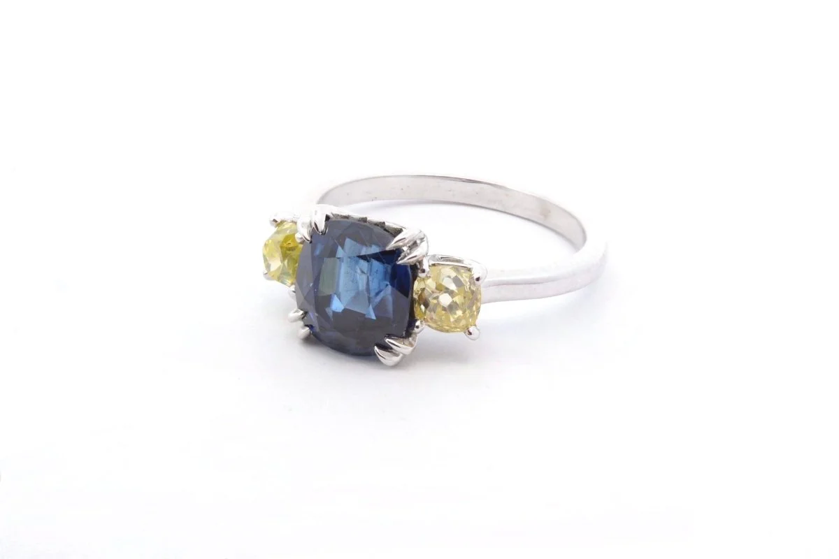 Sapphire and yellow diamond ring in platinum