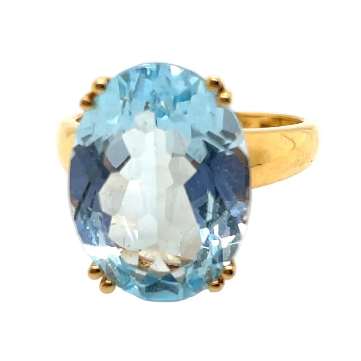 Yellow gold and topaz solitaire ring