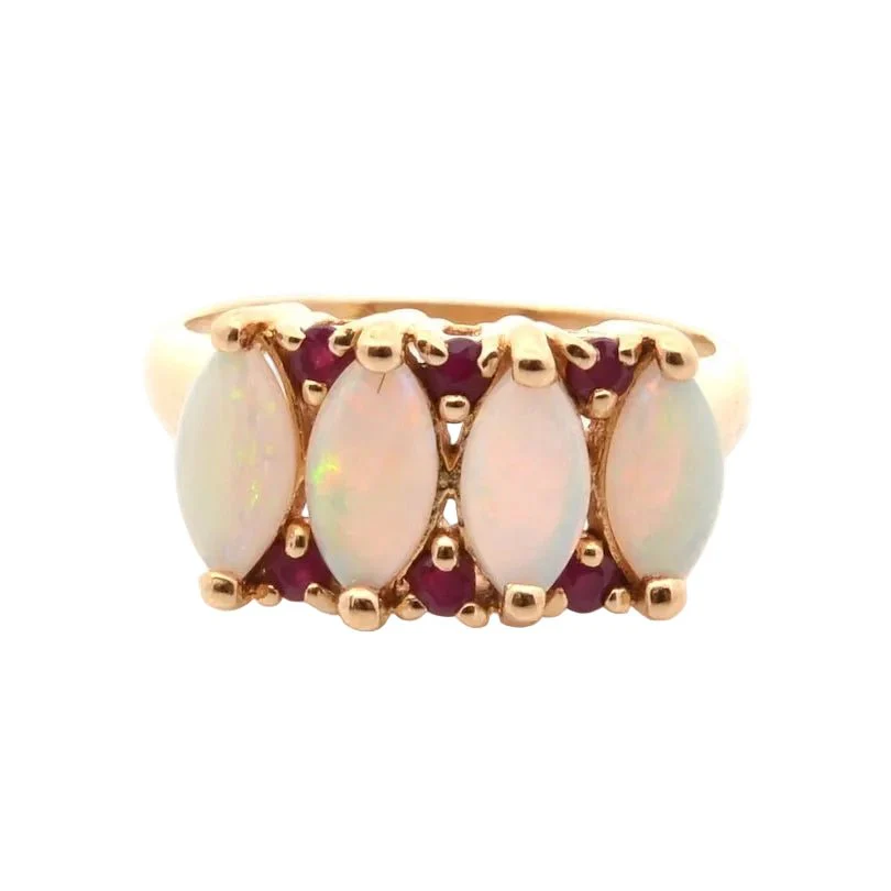 Ring in yellow gold, opals and rubies