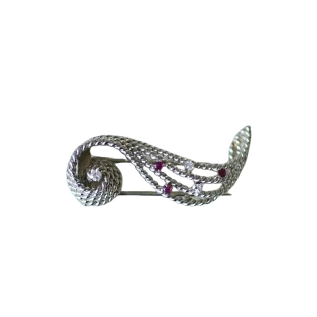 Diamond and ruby volute brooch