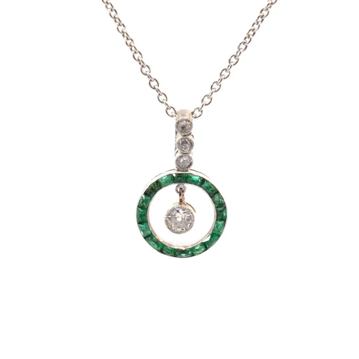 White gold, platinum, emeralds and diamonds pendant necklace