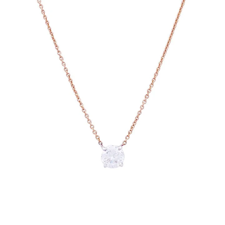 Two gold, diamond solitaire necklace.