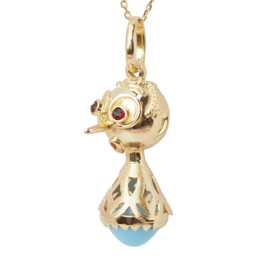 Pendant in yellow gold, turquoise and garnets