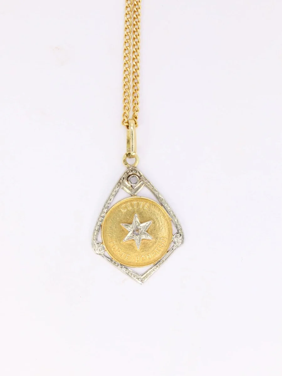 Vintage “Ce Toile Porte Bonheur” pendant in gold and diamonds