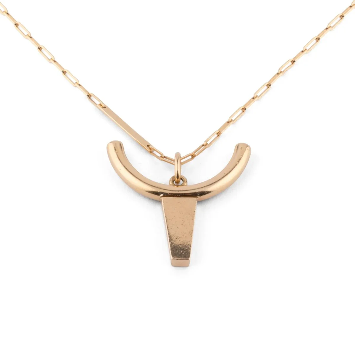 Yellow gold long necklace decorated with a pendant representing a bull's head