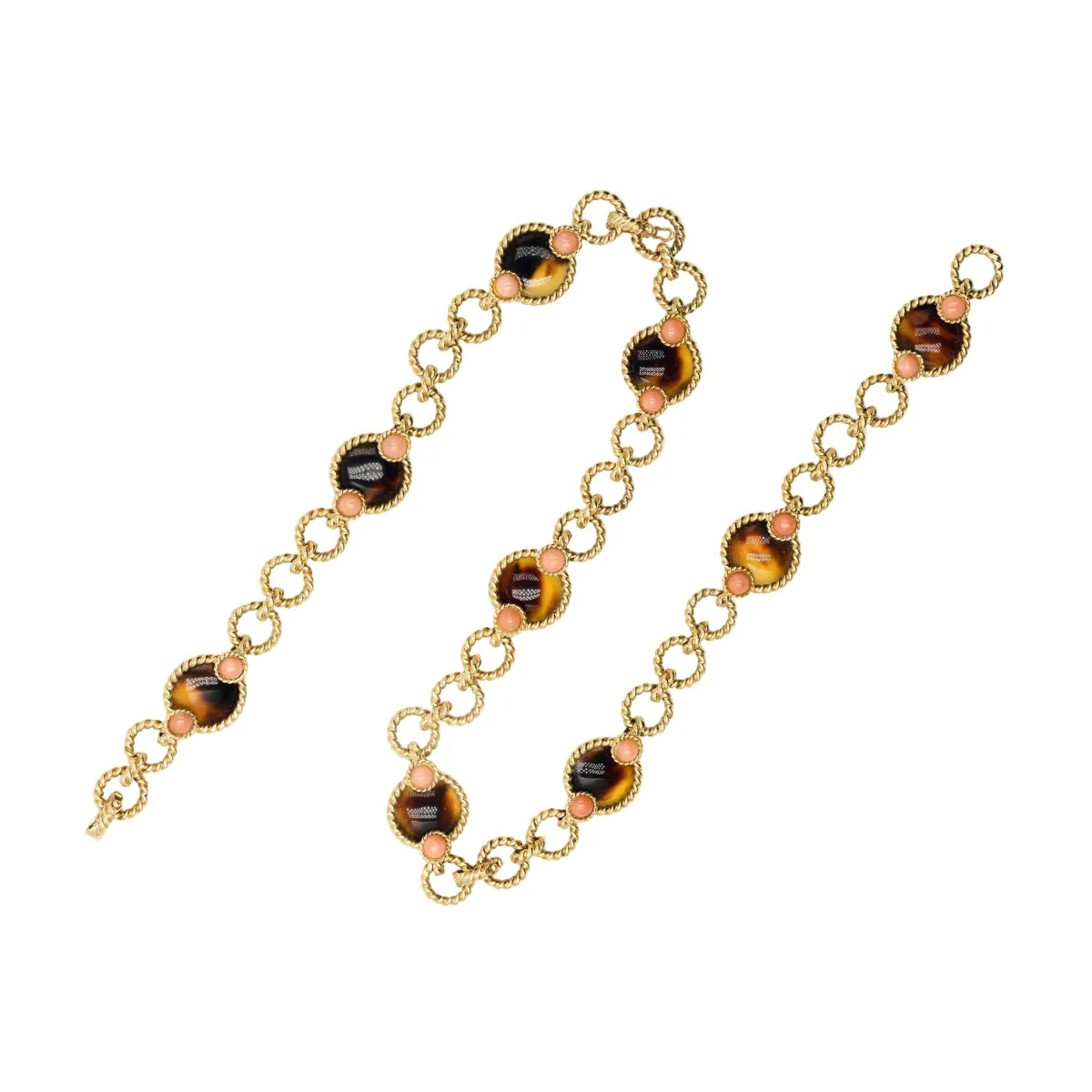 Three BOUCHERON bracelets in yellow gold and coral